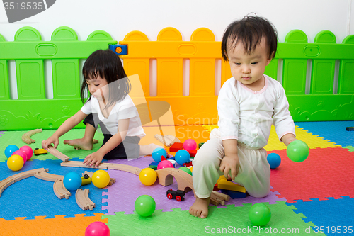 Image of Asian Chinese childrens playing with blocks