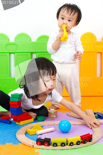 Image of Asian Chinese childrens playing with blocks