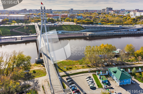 Image of Pedestrian Lovers Bridge on Tura river. Tyumen