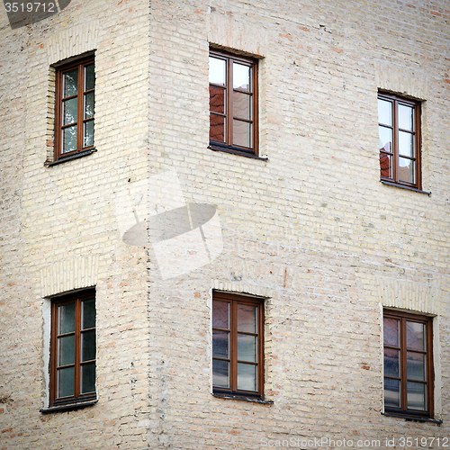 Image of old grunge brick wall with six windows