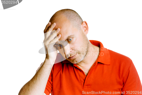 Image of Unshaven middle-aged man holding his head. Headache. Studio. iso