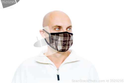 Image of Bald, man in a white jacket and mask. Studio. isolated