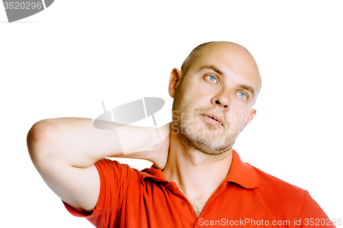 Image of Unshaven middle-aged man holding his neck. Pain. Studio. isolate