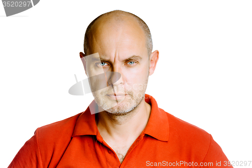 Image of Unshaven fearsome middle-aged man in a red T-shirt. Studio. isol