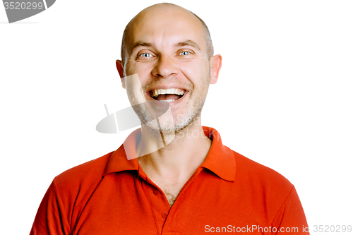 Image of Unshaven laughing middle-aged man in a red T-shirt. Studio. isol