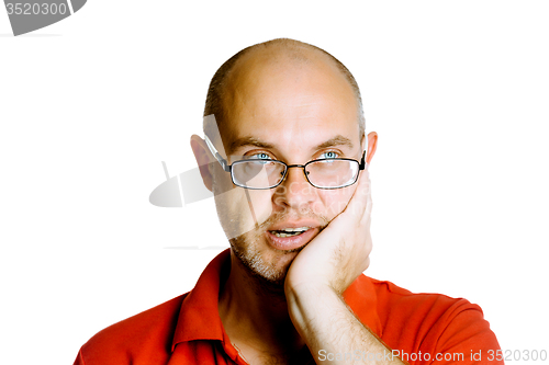 Image of Unshaven man with glasses holds on his cheek. Toothache. Studio.