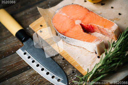 Image of steak salmon on wooden cutting