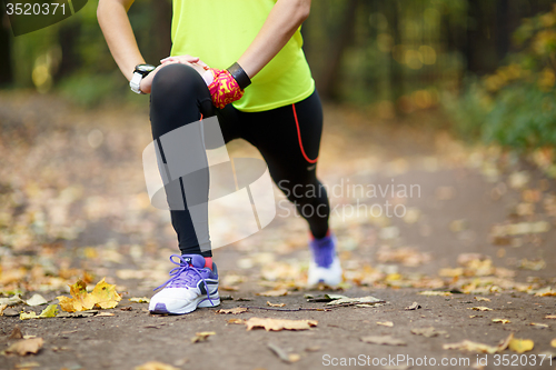 Image of woman exercising and stretching muscles