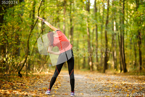 Image of woman exercising in park