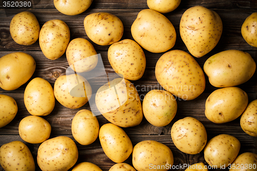 Image of potatoes on wooden background