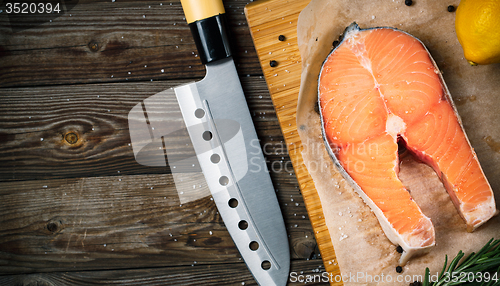 Image of Fresh and raw steak salmon on wooden cutting