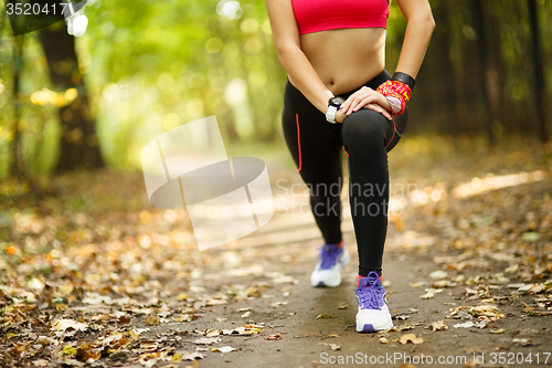 Image of woman exercising and stretching muscles