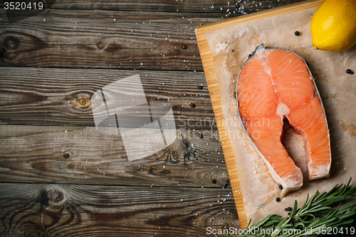 Image of Salmon on wood background