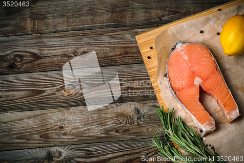 Image of Salmon on wood background