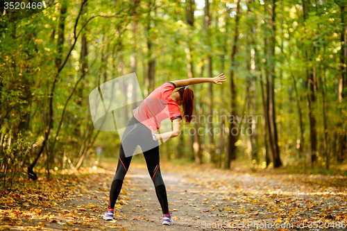 Image of woman exercising in park