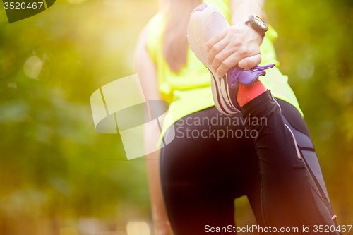 Image of woman exercising with bent leg