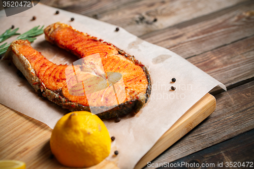 Image of Grilled salmon on wooden table