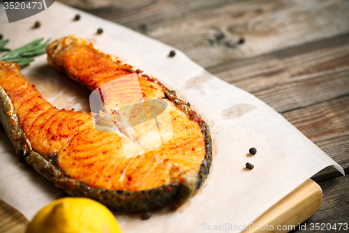 Image of Grilled salmon on wooden table