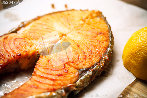 Image of Grilled red fish steak salmon and lemon