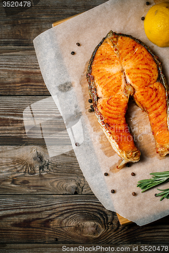 Image of Grilled salmon on wooden table