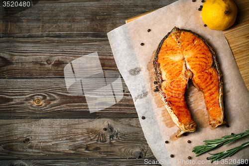 Image of Grilled salmon on wooden table