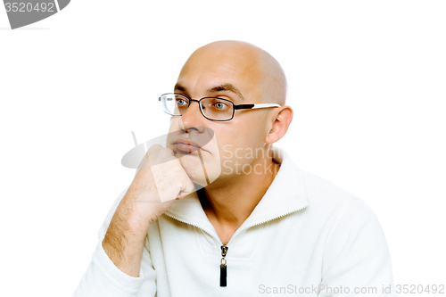 Image of pensive man in glasses. Studio. isolated