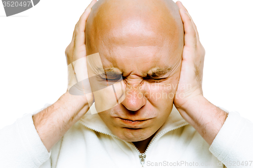 Image of man closed his eyes and covered his ears with his hands. Studio.