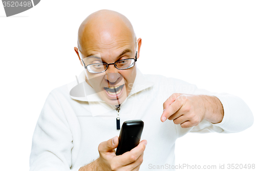 Image of Bald man screaming into the phone. Studio. isolated
