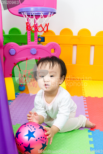 Image of Asian Chinese little boy playing basketball