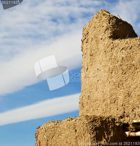 Image of brown old  construction in  africa morocco and  clouds  near the