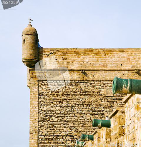 Image of  brick in old construction  africa morocco and   the tower near 