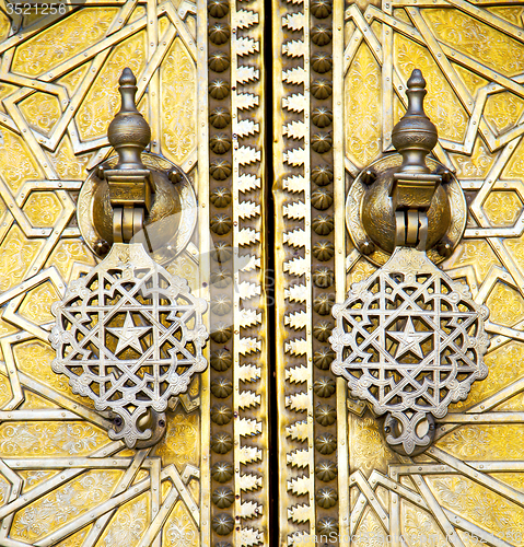 Image of metal rusty  brown    morocco in gold   facade home and safe pad