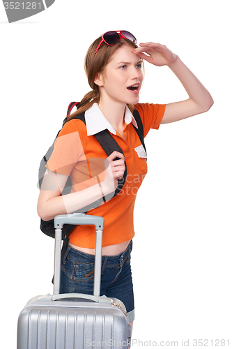 Image of Smiling girl with backpack and suitcase