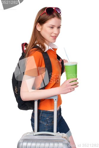 Image of Smiling girl with backpack and suitcase