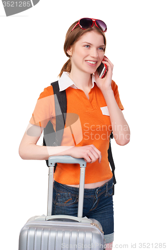 Image of Smiling girl with backpack and suitcase