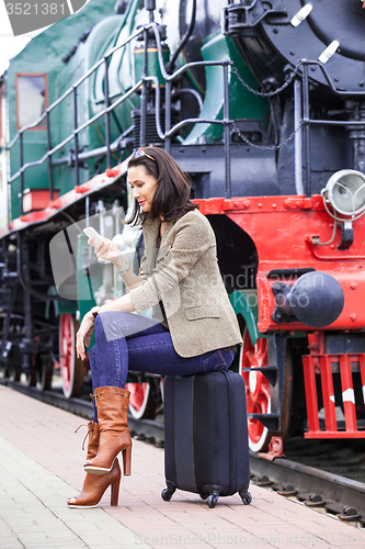 Image of pretty middle-aged woman with a mobile phone