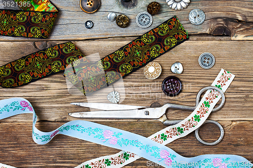Image of vintage lace, buttons and a dressmaker scissors