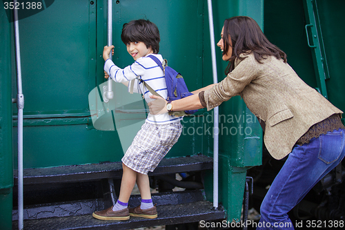 Image of Boy traveler and mother