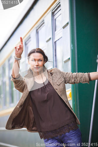 Image of beautiful middle-aged woman depart on a trip