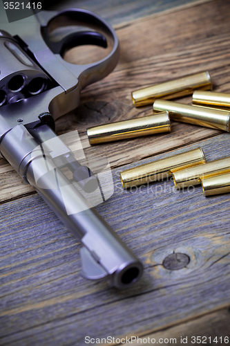 Image of part of an vintage nagant revolver with cartridges