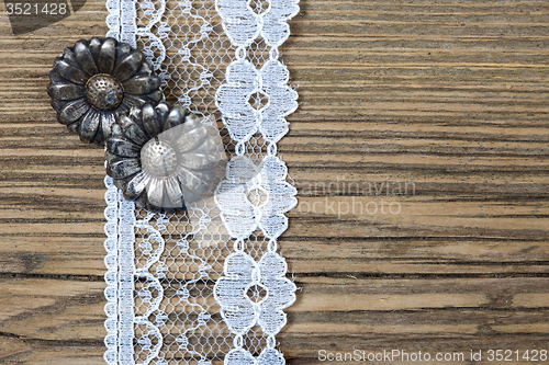 Image of vintage button and lace tape