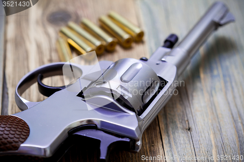 Image of Nagan revolver with cartridges