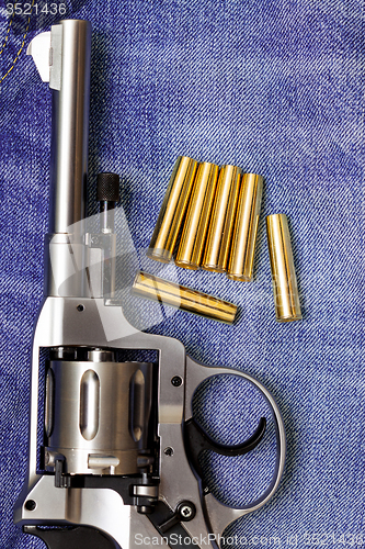 Image of Nagant revolver with cartridges