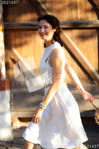 Image of beautiful middle-aged woman at summer day