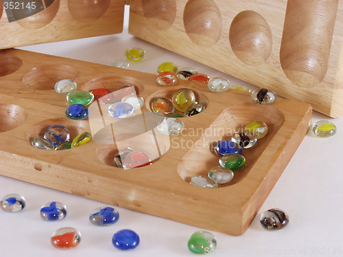 Image of Two Mancala boards, one standing