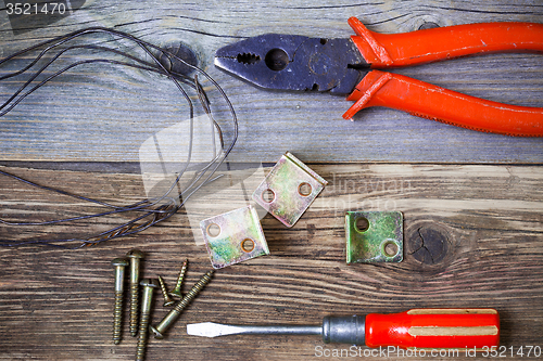 Image of Vintage pliers old screwdriver, screws, wire and metal corners