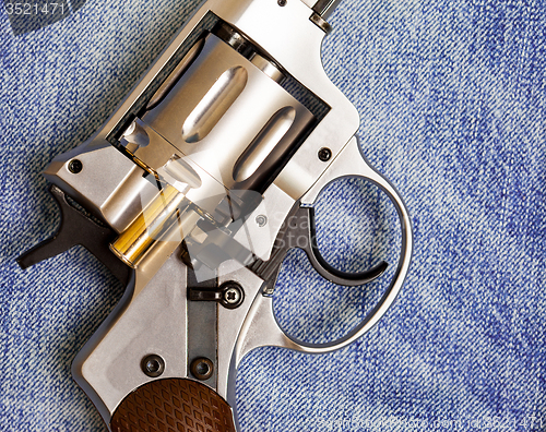 Image of Nagan revolver with cartridge