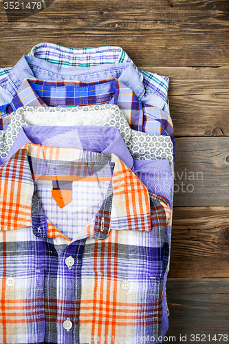 Image of stack of colored cotton shirts