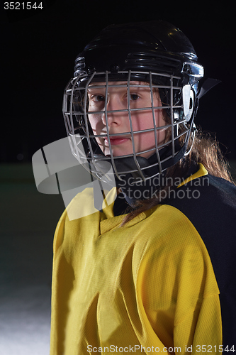 Image of teen girl  ice hockey player portrait