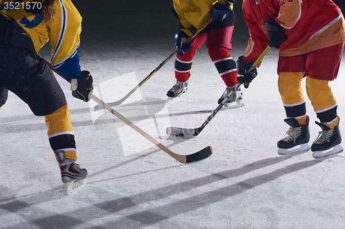 Image of teen ice hockey sport  players in action